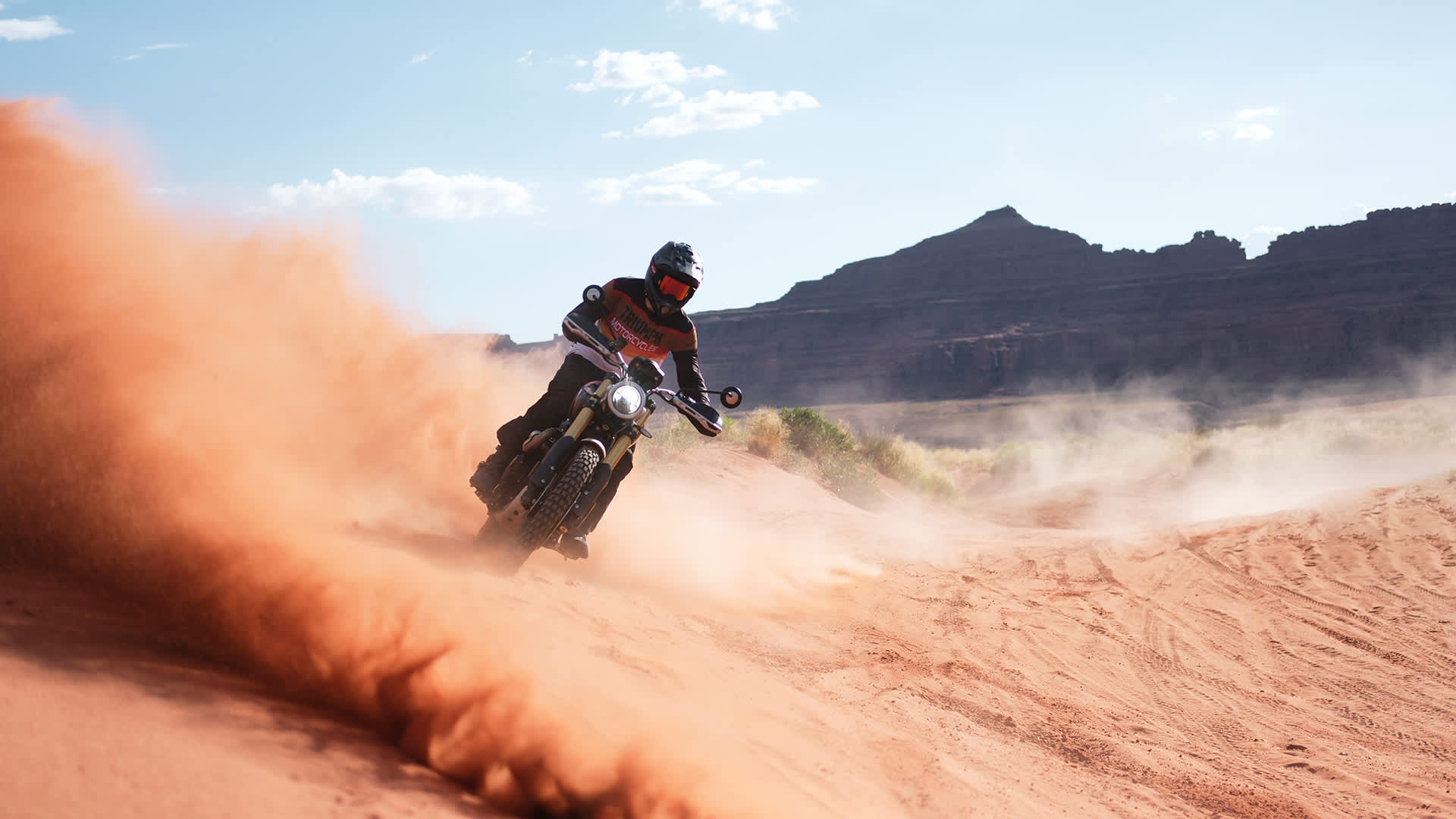 Triumph Scrambler 1200 XE riding in sand